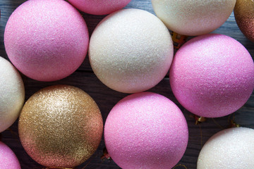 Varicoloured Christmas tree toys on the blue wooden background. Christmas and New Year background.