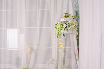 decorative cell with white flowers in the room