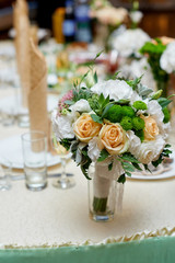 wedding table decorated with flowers and serving in the restaurant