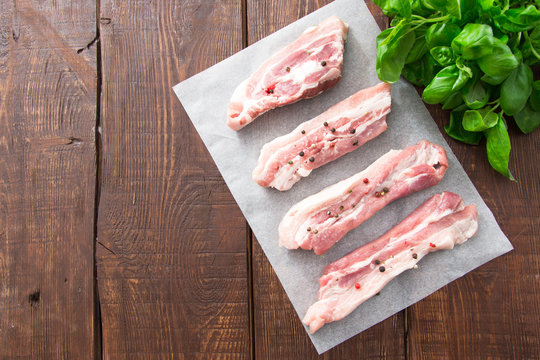 Raw meat. Pork ribs with herbs and spices