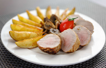 sliced pork steak with potatoes 