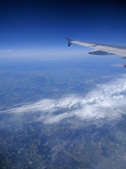 Fototapeta na wymiar Airplane wing in the sky