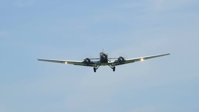 10920 A historic airplane, Junkers JU 52 (Nickname "Tante JU") fly over super close. No recognizable people, trademarks or logos!