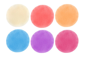 Set of six cosmetic sponge pads of different colors, isolated on white