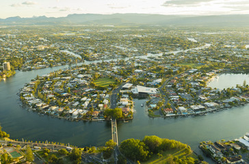 Aerial view of waterfront houses during sunset