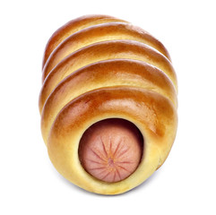 The sausage in the ruddy yeast bun with a golden crust isolated on white background.