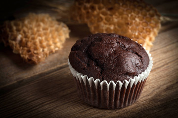 Chocolate muffin on dark background.