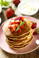 American pancakes with fresh strawberry and honey