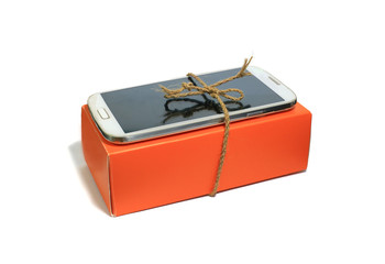 Smart phone on the orange box tied by rope, Smart phone on white background isolated.