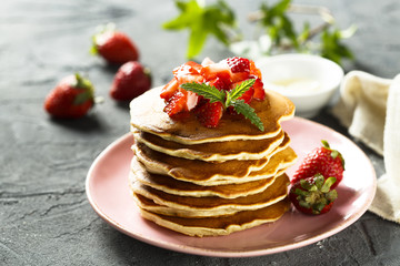 American pancakes with fresh strawberry and honey
