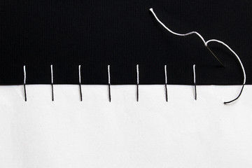 A black and white sewing
