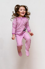 Happy kid pajama jumping