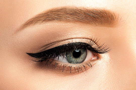 Close up view of gray woman eye with beautiful makeup