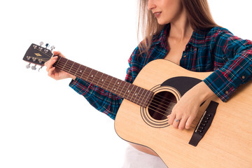 woman playing guitar in studio