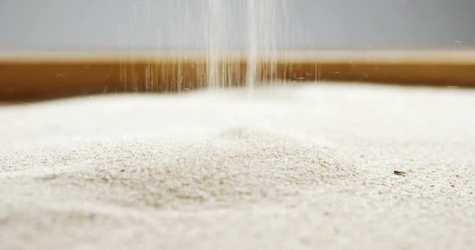 Close-up of pouring sand