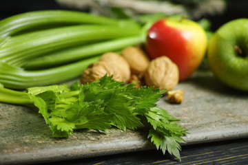 Fototapeta na wymiar Ingredients for Waldorf salad - celery, apples, walnuts