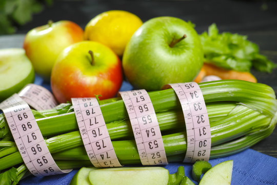 Green vegetables and fruits -  celery shoots and  apples, dietary diet