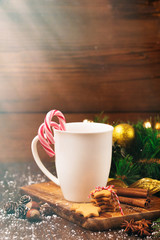 Сup with Christmas hot drink, Candy Canes and gingerbread cooki