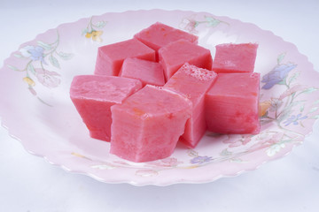 Colorful of Coconut Jelly or Layer Sweet Cake (Thai name is Kanom Chan) on white dish. Thailand ancient dessert