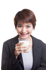 Healthy Asian woman drinking a glass of milk.