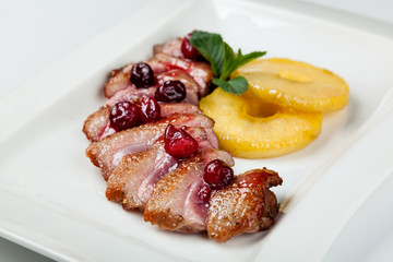 grilled duck meat with cherry sauce
