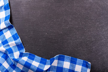 checkered tablecloth on dark background