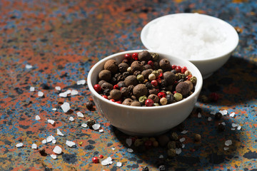 assortment of pepper and sea salt on a dark background