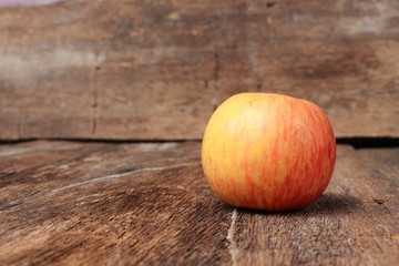 Red Apple Close up,select focus with shallow depth of field wooden floor background