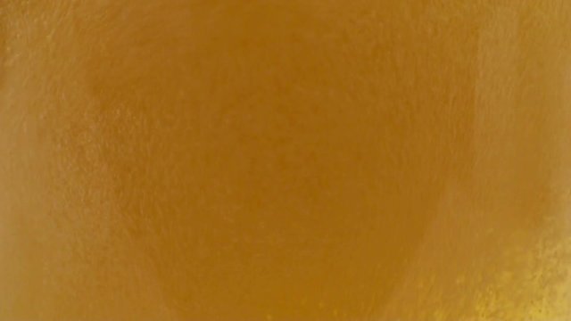 Close-up view of beer foam in a glass. HD 1920x1080 Video Clip