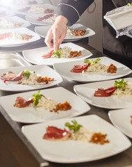 Chef decorating appetizer plate