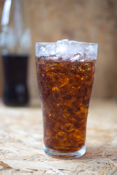 aerated soft drink on wooden background
