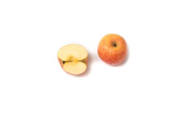 .red apple and slice on white background, top view