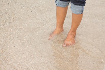 barefoot legs walking in the sea , Vacation on summer 
