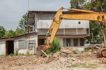 Excavator, bulldozer in work demolition construction 
