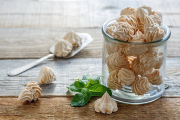 Delicate meringue and mint in a glass jar.