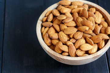 Bowl with almonds closeup.