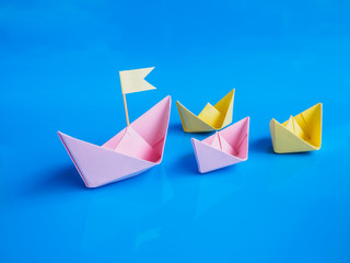 Leadership and team work concept, Craft of paper boat group  