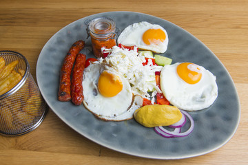 Traditional breakfast - fried eggs,sausages,salad