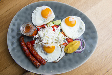 Traditional breakfast - fried eggs,sausages,salad
