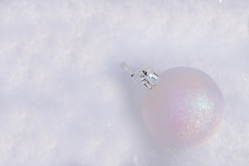 Christmas ball in the snow