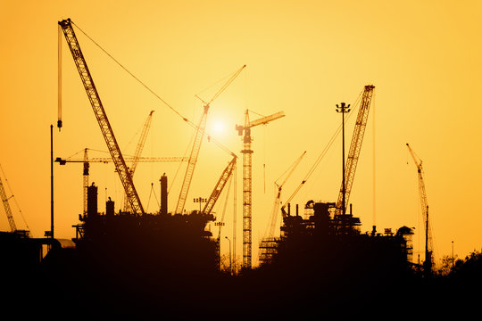 Silhouette construction site in sunset..