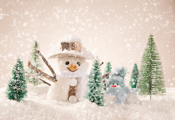 Christmas snowmen on abstract background
