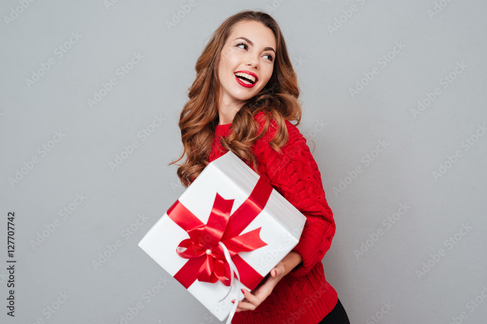 Sticker happy pretty young woman holding gift box