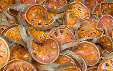 Many Dried quince in basket for made herb beverage and local medical, in Thailand.