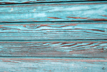 Holzwand türkisfarbene Bretter