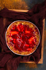 Strawberry tart over stone table