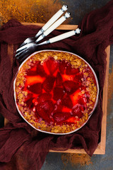 Strawberry tart over stone table