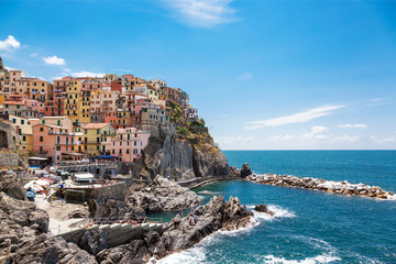 Fototapeta na wymiar colorful houses on a rock near the sea in Manarola, Cinque Terre
