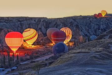 Obraz premium Colorful hot air balloons before launch at Cappadocia, Turkey. Volcanic mountains in Goreme national park