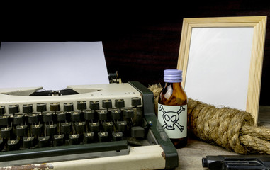 Typewriter with paper page and poison and gun. Concept writer Ro - obrazy, fototapety, plakaty